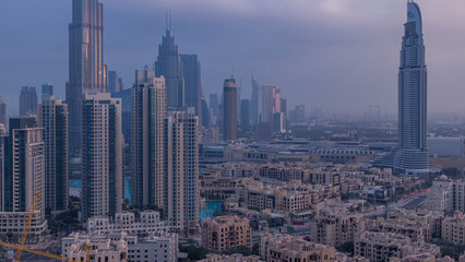 Fototapeta na wymiar Dubai Downtown at sunrise timelapse. Aerial view over big futuristic city.