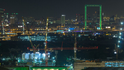 Fototapeta na wymiar Dubai skyline night timelapse with illuminated landmarks