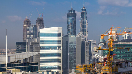 Dubai business bay towers at day time aerial timelapse.