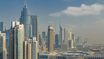 Downtown Dubai skyline with skyscrapers and towers timelapse, view from rooftop.