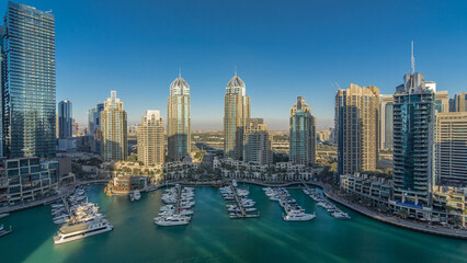 Dubai Marina skyscrapers aerial timelapse, port with luxury yachts and marina promenade - obrazy, fototapety, plakaty