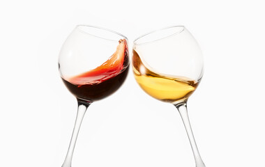 Glasses of red, white wine clink during toast. - 767106484
