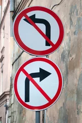 Fototapeten L’viv Ukraine. Signs disallowing both right and left turns - straight ahead only. © Richard