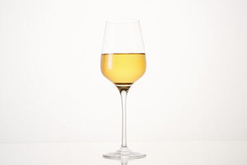 Half wineglass filled with exquisite white wine.