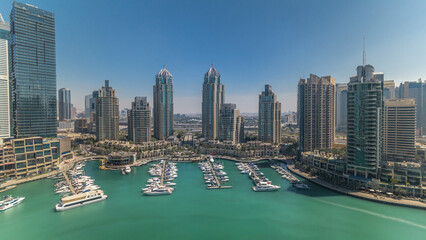 Dubai Marina skyscrapers aerial all day timelapse, port with luxury yachts and marina promenade