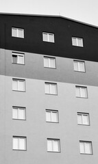 Revolutionizing urban architecture. Modern window frames and facade wall background. Pattern and texture. Black and white, monochrome.