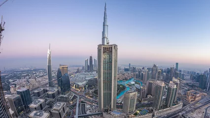 Foto op Plexiglas Dubai Downtown day to night timelapse modern towers panoramic view from the top in Dubai, United Arab Emirates. © neiezhmakov