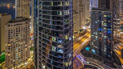 Obraz premium Night illumination of Dubai Marina aerial timelapse, UAE.
