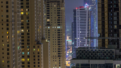 Fototapeta na wymiar Night illumination of Dubai Marina aerial timelapse, UAE.