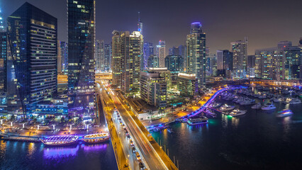 Fototapeta na wymiar Water canal on Dubai Marina skyline at night timelapse.