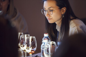Female Sommelier Readies For Blind Wine Tasting At A Well-Set Table - 767113853