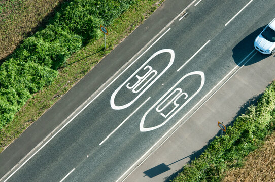 Flax Bourton Bristol UK Aerial view of B3130 road with speed limits painted on the road.