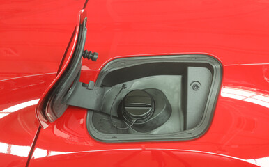 Open fuel tank door on car for fueling gasoline or diesel open. Transportation industry concept  