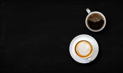 hot coffee and bean on black wooden table background. top view