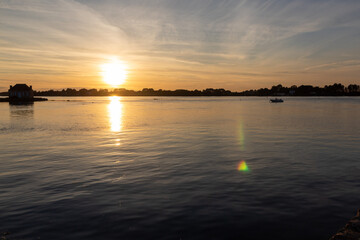 house on the river at sunset