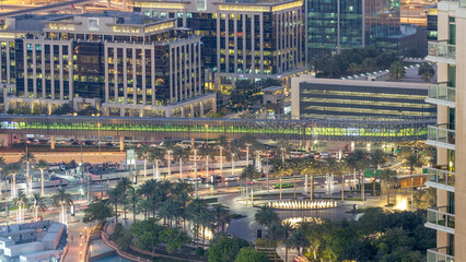 Obraz premium Fountains near main entrance to the tallest skyscraper night timelapse, Dubai