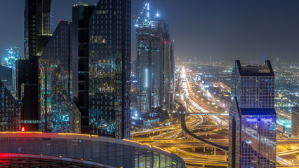 Fototapeta na wymiar Dubai downtown skyline night timelapse and Sheikh Zayed road traffic, UAE
