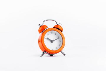 Orange The clock sets the time to 10.00. on white background isolate.