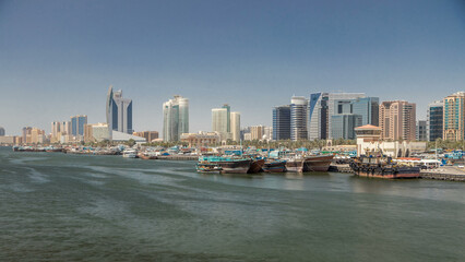 Obraz premium Trading wooden boats in the port timelapse. Merchant ships on the Creek Canal.