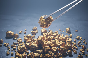 Precious Gold Nuggets Precisely Handled with Tweezers Against a Dark Backdrop - 767129217