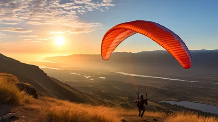 Abwaschbare Fototapete Paraglider Soaring in Mountain Valley at Sunrise © Nick Alias