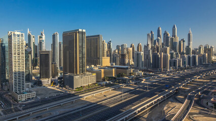 Fototapeta na wymiar Dubai Marina skyscrapers aerial top view at morning from JLT in Dubai timelapse, UAE.