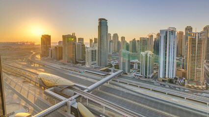 Fototapeta na wymiar Dubai Marina with colorful sunset in Dubai aerial timelapse, United Arab Emirates