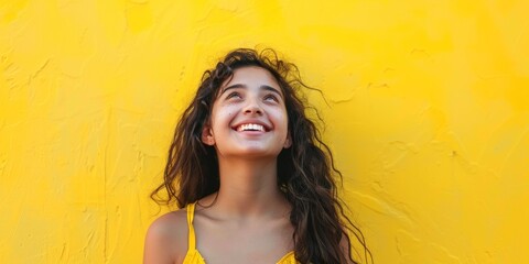 Central American Girl Smiling Against Yellow
