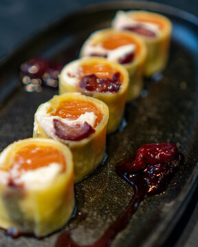 Delicious gourmet Sushi in a black table with black plates