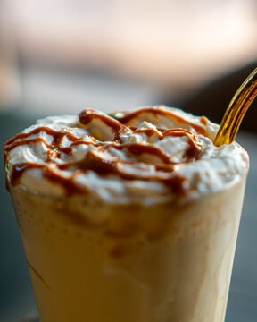 Cold beverage made out of coffee and milk from proffesional brewer of a coffee shop