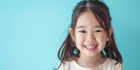 Joyful East Asian Girl Smiling
