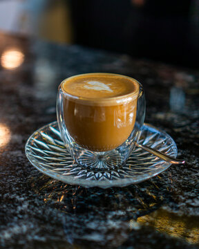 Latte on a transparent glass coffee mug from professional coffee brewers from a coffee shop