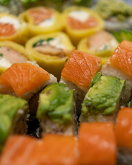 Close up macro shot of delicious gourmet Sushi in a black table with black plates