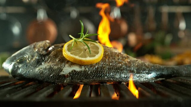 Super Slow Motion of Sea Bream Fish on Grill. Filmed on High Speed Cinema Camera, 1000 fps.