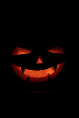 Face of a jack-o-lantern in the darkness