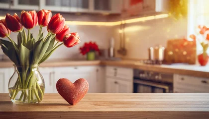 Fotobehang st valentines day themed border on kitchen table with love heart and red tulips and blurred kitchen in the background © Tomas