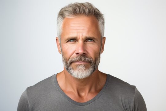 Handsome middle-aged man with gray hair and beard.