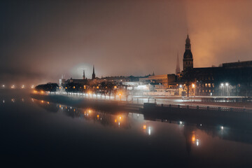 Old city Riga covered in mist - obrazy, fototapety, plakaty