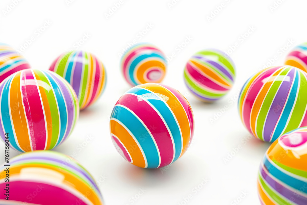 Poster a bunch of colorful striped balls are scattered across a white background. the balls are of various 