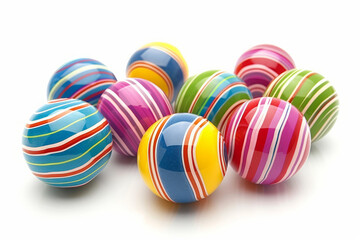 Fototapeta na wymiar A bunch of colorful striped balls are scattered across a white background. The balls are of various sizes and colors, creating a vibrant and playful atmosphere. Concept of fun and joy