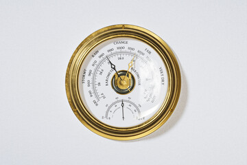 Elegant Antique Gold Barometer Against a Pristine White Background