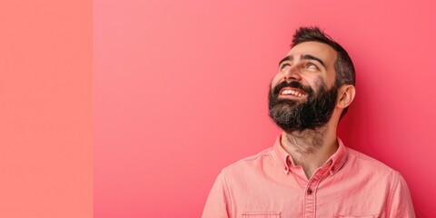 Middle Eastern Man Smiling Against Pink - obrazy, fototapety, plakaty