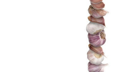 Stacked heads and cloves of garlic on white background. Banner design with space for text