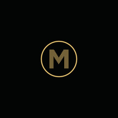 Simple gold letter M logo, with circles and black background