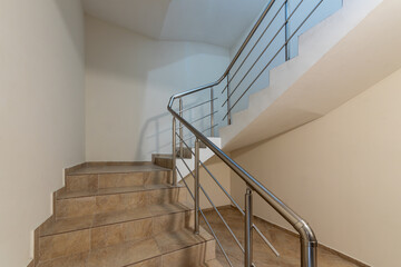 Modern stair case between floors. Stairs with metallic rail  in modern building - 767169639