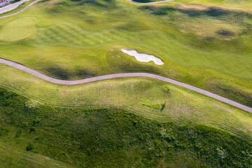 Aerial view of a beautiful green golf course - 767169661