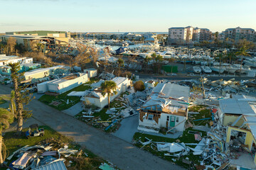 Strong hurricane winds severely damaged private houses in Florida mobile home residential area....