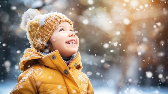 The image shows a happy child or girl wearing winter clothes playing in the snow, representing