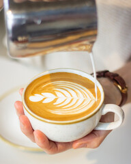 Coffee being made by a barista