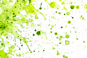 Vivid green watercolor paint splashes spread on white background
